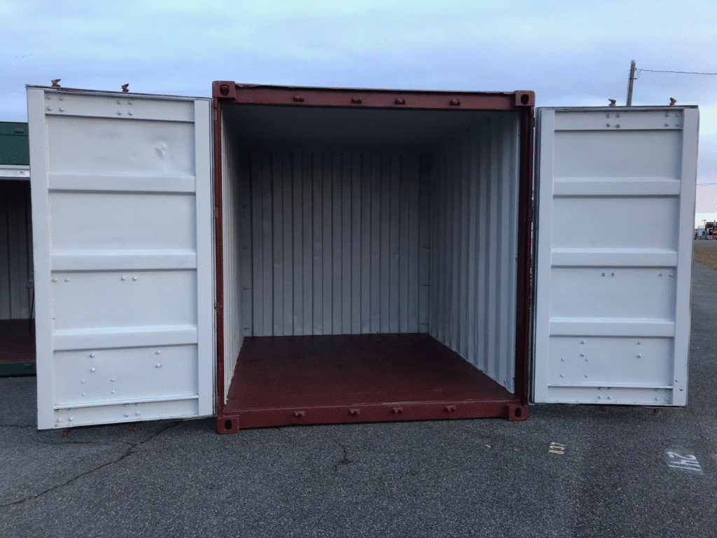 Open 10ft shipping container on asphalt, ready for storage or transport use.