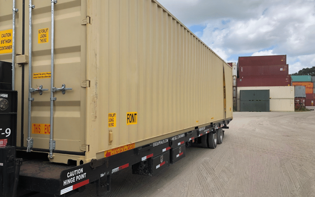 Shipping container on truck trailer at industrial storage yard with stacked containers in background.