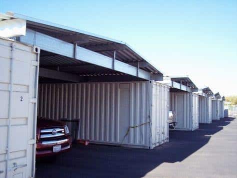 Row of car storage units with covered parking; secure and spacious vehicle storage solution.